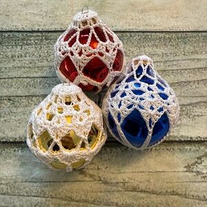 3 vintage glass crochet wrapped ornaments.